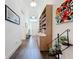Hallway featuring wood-look tile flooring and an open layout with stylish furnishings at 15503 Corona Del Mar Dr, Wimauma, FL 33598