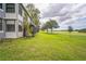 Wide grassy backyard overlooking a scenic golf course and lake at 1967 Cormorant Ct # 516, Clearwater, FL 33762