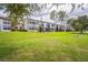 Exterior view of modern townhouses with grassy backyard at 1967 Cormorant Ct # 516, Clearwater, FL 33762
