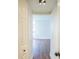 Hallway view highlighting fresh white paint and modern lighting, leading into a bright room at 1967 Cormorant Ct # 516, Clearwater, FL 33762