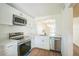 The recently renovated kitchen with stainless appliances and quartz countertops at 1967 Cormorant Ct # 516, Clearwater, FL 33762