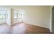 Open-concept living room featuring wood-look floors and lots of natural light at 1967 Cormorant Ct # 516, Clearwater, FL 33762
