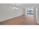 A spacious living room with new wood floors and large glass windows with golf course views at 1967 Cormorant Ct # 516, Clearwater, FL 33762