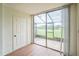 Screened patio with door and views of the outdoors at 1967 Cormorant Ct # 516, Clearwater, FL 33762