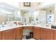 Bathroom featuring and sinks, a vanity, and a corner shower at 20074 Heritage Point Dr, Tampa, FL 33647