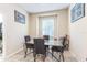 Bright breakfast nook with a glass table, seating for four, and natural light at 20074 Heritage Point Dr, Tampa, FL 33647