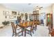 Formal dining room featuring carpeted floors, ample art, and a wooden table with seating for six at 20074 Heritage Point Dr, Tampa, FL 33647