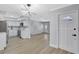 Modern kitchen featuring sleek, white cabinetry, stainless steel appliances, and ample countertop space at 4928 Stolls Ave, Tampa, FL 33615