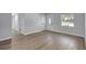 Inviting living area with wood floors and a view of the front entrance, creating a warm, welcoming atmosphere at 4928 Stolls Ave, Tampa, FL 33615
