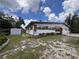 An expansive backyard featuring a storage shed and a neatly landscaped lawn at 5627 Oakland Dr, Tampa, FL 33617