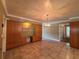 Open dining room featuring built-in cabinets and tile flooring at 5627 Oakland Dr, Tampa, FL 33617