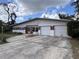 Charming single-story home featuring a two-car garage and a brick facade at 5627 Oakland Dr, Tampa, FL 33617