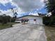 Charming single-story home featuring a two-car garage and a brick facade at 5627 Oakland Dr, Tampa, FL 33617