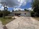Charming single-story home featuring a two-car garage and a brick facade at 5627 Oakland Dr, Tampa, FL 33617