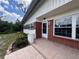 A brick-paved front porch welcomes you to this charming home with its neat windows and trim at 5627 Oakland Dr, Tampa, FL 33617