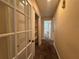 Hallway with carpet flooring, closet and access to other rooms in the home at 5627 Oakland Dr, Tampa, FL 33617