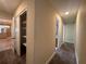 Hallway features carpet, storage, and leads to other rooms in the house at 5627 Oakland Dr, Tampa, FL 33617