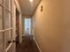 Hallway featuring carpet flooring, closet storage space and doorways at 5627 Oakland Dr, Tampa, FL 33617