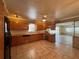 Bright kitchen with tile floor, wood cabinets, and black appliances at 5627 Oakland Dr, Tampa, FL 33617