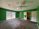 Spacious main bedroom features a walk-in closet, carpet, and sliding glass doors at 5627 Oakland Dr, Tampa, FL 33617