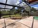Covered patio area with view of grass and water feature at 5627 Oakland Dr, Tampa, FL 33617