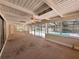 Sun room with ceiling fan and sliding glass doors offering pool views at 5627 Oakland Dr, Tampa, FL 33617