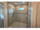 Modern bathroom with glass shower and tile walls offering a luxurious experience at 3441 Gramercy Ln, Spring Hill, FL 34609