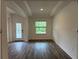 Inviting living room with coffered ceilings and wood flooring, creating an elegant space at 3441 Gramercy Ln, Spring Hill, FL 34609