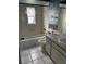 Traditional bathroom with a tub, toilet, and vanity with a faux marble countertop at 4650 Orlando Cir, Bradenton, FL 34207