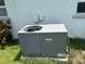 Exterior shot of the air conditioning unit and surrounding greenery at 4650 Orlando Cir, Bradenton, FL 34207