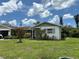 Charming single-story home with a well-maintained lawn and vibrant landscaping at 4650 Orlando Cir, Bradenton, FL 34207