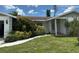Charming home with a well-maintained front yard, sidewalk, and lush bushes at 4650 Orlando Cir, Bradenton, FL 34207