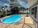 Sparkling pool area with a screened enclosure and adjacent home exterior at 4650 Orlando Cir, Bradenton, FL 34207