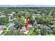 Aerial view showcasing the property, highlighting its location and the surrounding landscape and neighborhood at 2531 Lake Ellen Dr, Tampa, FL 33618