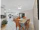 Open-concept dining area with a table, chairs, and a ceiling fan next to the kitchen at 2531 Lake Ellen Dr, Tampa, FL 33618
