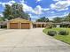 Charming single-story home features a well-maintained lawn, mature trees, and a two-car garage at 2531 Lake Ellen Dr, Tampa, FL 33618