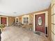 Inviting covered front porch with decorative seating, plants, and a stylish front door at 2531 Lake Ellen Dr, Tampa, FL 33618