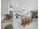 Bright kitchen featuring white cabinetry, stainless steel appliances, and a cozy breakfast bar with seating at 2531 Lake Ellen Dr, Tampa, FL 33618