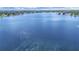 Scenic aerial shot of a large, tranquil lake surrounded by lush greenery and residential areas at 2531 Lake Ellen Dr, Tampa, FL 33618