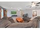Inviting living room with comfortable seating, a large flat screen TV, and a cozy rug at 2531 Lake Ellen Dr, Tampa, FL 33618