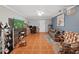 Bright living room featuring tile floors, comfortable seating, and a mounted flat screen TV at 2531 Lake Ellen Dr, Tampa, FL 33618