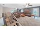 Spacious living room boasts a large sectional sofa, ceiling fans, and a cozy fireplace at 2531 Lake Ellen Dr, Tampa, FL 33618
