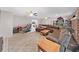 Open-concept living room with tile flooring, a comfortable sofa, and a view into the kitchen at 2531 Lake Ellen Dr, Tampa, FL 33618