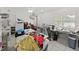 Multi-purpose room featuring ample counter space, sewing machines, and natural light at 2531 Lake Ellen Dr, Tampa, FL 33618