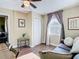 Bedroom with seating, closet, window, and view into another bedroom at 2904 Sanchez St, Tampa, FL 33605