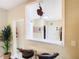 View of the dining area with bar seating that adjoins a pass-through to the kitchen at 2904 Sanchez St, Tampa, FL 33605