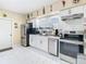 Renovated kitchen with modern white cabinets, stainless steel appliances, and stylish countertops at 2904 Sanchez St, Tampa, FL 33605