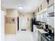 Bright kitchen featuring stainless appliances, white cabinetry, and marble tile floors at 2904 Sanchez St, Tampa, FL 33605