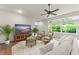Bright living room with modern furniture, large windows, and natural lighting at 15007 Laurel Cove Cir, Odessa, FL 33556