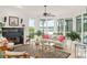 Bright living room featuring a fireplace, large windows with lake views, and elegant decor at 15007 Laurel Cove Cir, Odessa, FL 33556